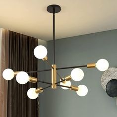 a chandelier hanging from the ceiling in a living room