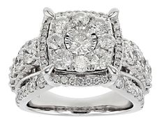 a white gold diamond ring with two rows of diamonds on the band and an oval shaped center