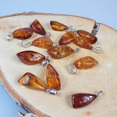 Welcome to handmade Baltic Amber jewelry shop. This Item is made of genuine, natural Amber. This item will make You look simple but gorgeous. Real natural Baltic Amber pendant. Handmade of real healing gemstone. Unisex style. Will be perfect gift for him or her. Small and tiny gemstone cabochons.   Length: ~  2.2 - 2.5 - 3 cm, You will get one Random pendant. Very light gemstone.  Our handmade jewelry is made with passion and love. If you have any problems with your order please contact us. Please note that colors can vary from originals depending on computer monitor's settings. Due to amber is being unique and natural gemstone, each item may be slightly different in shades or shapes. Items may have natural imperfections like lines and spots, specks, coloration and inclusions, layers and l Handmade Baltic Amber Spiritual Jewelry, Artisan Amber Jewelry With Natural Inclusions, Handmade Baltic Amber Teardrop Jewelry, Baltic Amber Jewelry With Natural Stones For Gifts, Round Cabochons With Natural Stones For Gifts, Round Natural Stone Cabochons For Gift, Artisan Amber Gemstones As Gift, Amber Gemstones For Gifts, Insect Ring