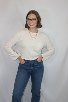 Everyday and simple cream ribbed knit top with long sleeves, cropped fit, and front pocket details details & fit: fits true to size. 64% cotton, 30% polyester, 6% spandex measurements: small: bust 36"/ waist 36"/ length 17.5" medium: bust 38"/ waist 38"/ length 18" large: bust 40"/ waist 40"/ length 18.5" model details: model is 5'7" and wearing size small White Long Sleeve Cropped Sweater With Ribbed Neckline, White Cropped Sweater With Ribbed Neckline And Long Sleeves, Beige Long Sleeve Cotton Crop Top, Everyday Long Sleeve Cropped Sweater For Spring, Everyday Long Sleeve Cotton Knit Top, Everyday Cotton Knit Top With Long Sleeves, Cotton Cropped Sweater With Textured Knit And Long Sleeves, Textured Knit Cotton Cropped Long Sleeve Sweater, Textured Knit Cotton Cropped Sweater With Long Sleeves