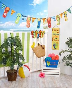 there is a beach themed room with decorations on the balcony