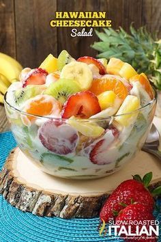 a fruit salad is served in a glass bowl