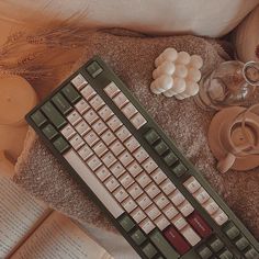 a computer keyboard sitting on top of a blanket