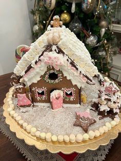 a decorated gingerbread house on top of a table