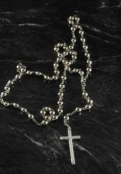 "For sale is a vintage rosary beaded cross necklace. This necklace is silver tone metal with silver tone metal beads. The cross measures 3/4 x 1 1/2\". The rosary chain measures 24\" with a 3 1/2\" drop. New Treasures added all the time. Check back often!" Silver Cross-shaped Jewelry With Beaded Chain, Silver Cross Jewelry With Beaded Chain, Silver Beaded Cross Necklace For Gift, Silver Cross Rosary Bracelet, Silver Cross Necklace With Beaded Chain, Silver Beaded Chain Rosary, Silver Cross-shaped Rosary Bracelet With 8mm Beads, Silver Cross Rosary Spiritual, Spiritual Silver Cross Rosary