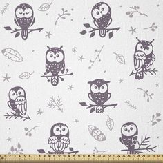 several owls sitting on branches with leaves and stars