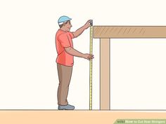 a man measuring the height of a wooden frame