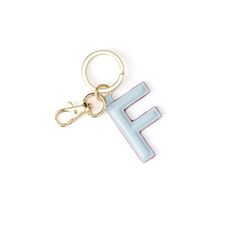 a keychain with the letter e on it's front and back sides