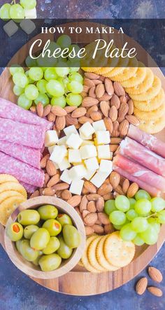 a platter with cheese, crackers and olives on it that says how to make a cheese plate