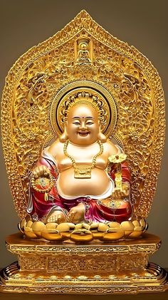 a golden buddha statue sitting on top of a table