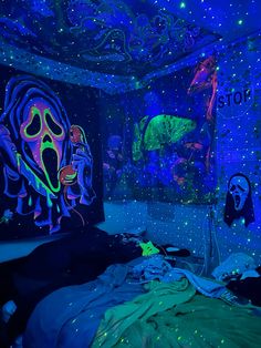 a bedroom with blue and green lights on the ceiling, walls painted in neon colors