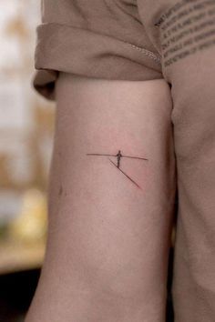 a person with a small tattoo on their arm