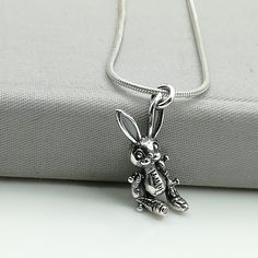 ▪︎ ONE sterling silver rabbit pendant/charm. ▪︎ This is a multi functional charm and can be used with neck chains, bracelets, key chains etc. ▪︎ Size: 21 x 10 mm ▪︎ This pendant is handmade with hypoallergenic sterling silver, and is nickel free. Comes with a 925 mark for authenticity. ▪︎ Please note: Price listed is for ONE charm. This pendant comes without the chain, however, you can add a snake neck chain, bracelet chain or hoop in the required size while making your selection. ▪︎ All jewelry Cute Silver Charm Necklaces, Whimsical Silver Charms For Gifts, Cute Silver Pendant Charm Necklace, Silver Novelty Necklaces With Charms, Novelty Silver Necklaces With Charms, Silver Novelty Charm Necklace, Whimsical Silver Dangle Charm Necklaces, Silver Bunny Design Jewelry For Gifts, Silver Bunny Design Jewelry Gift