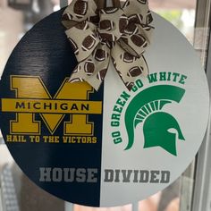 a michigan and michigan football themed door hanger