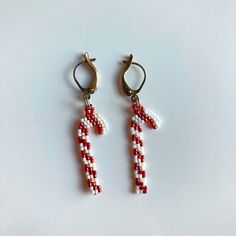 Handmade Beaded Candy Cane Earrings, 2” Long Including The Metal, The Beading Alone Hangs 1.25” Long. Beaded Santa Earrings Pattern, Seed Bead Christmas Earring Patterns, Crochet Candy Cane Earrings, White Ear Wire Earrings For Holiday, White Holiday Earrings With Ear Wire, White Beaded Christmas Jewelry, White Beaded Dangle Earrings For Christmas, White Beaded Christmas Dangle Earrings, Handmade White Beaded Earrings For Christmas