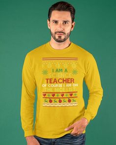 a man wearing a yellow sweater with the words i am a science teacher on it