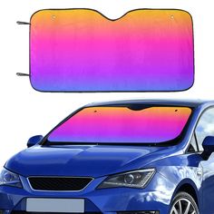 a blue car with a pink and orange sunroofer on it's windshield