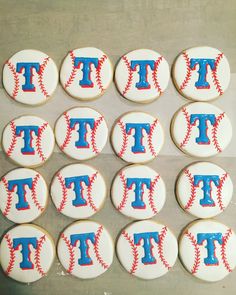 twelve decorated cookies with the letters t and baseballs on them are arranged in rows