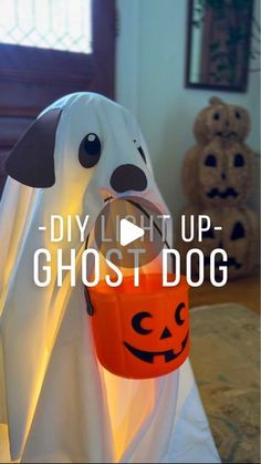 a ghost with a bucket in it's mouth and the words diy light up ghost dog