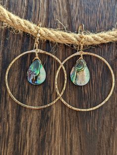 These Beautiful hand Crafted hoop earrings were hand forged and texturized with 14k Gold Filled Wire.  I then lovingly hung beautiful iridescent teardrop abalone beads.  Also available in Sterling Silver & Rose Gold Filled.  Custom creations are available as well just send me a message☺️ A great gift for a loved one or even for yourself❤️