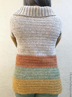 the back of a woman's sweater with multicolored knits on it