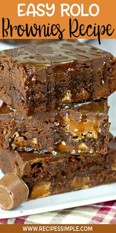 three brownies stacked on top of each other with caramel drizzles