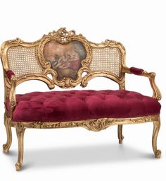 an ornately decorated bench with red velvet upholstered seat and gold trimming