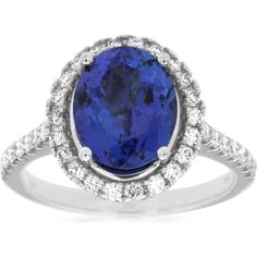 Royal 14K White Gold Halo Ring with Oval Tanzanite and Round Diamonds - 2.90 Carat Tanzanite, 0.60 Carat Diamond Total Weight Luxury Royal Blue Tanzanite Jewelry, Gold Halo Ring, Tanzanite And Diamond Ring, Timeless Glamour, Oval Diamond Ring, Tanzanite Diamond Ring, Halo Design, Tanzanite Diamond, Gold Halo