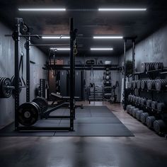 an empty gym with rows of weight machines and weights on the wall, in front of a row of black dumbbells