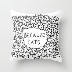 a black and white pillow that says because cats