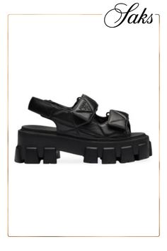 These flatform sandals with a modern menswear-inspired silhouette are enhanced by the quilted detail that echoes the iconic shape of the Prada triangle. The sporty style made of nappa leather is enriched by the distinctive monolith sole that combines important volumes with light rubber, becoming an expression of Prada's dual soul. Upper with padding and stitching Rubber sole, height: 55 mm (2.16'') Lug tread Imported Luxury Chunky Platform Sandals, Luxury Calf Leather Sandals With Textured Sole, Leather Sport Sandals With Lug Sole, Trendy Leather Platform Sport Sandals, Trendy Leather Sandals With Lug Sole, Modern Leather Platform Sport Sandals, Luxury Leather Sport Sandals For Summer, Prada Triangle, Flatform Sandals