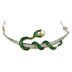 This Antique Diamond Crescent Necklace with Snake holding a pearl is on a diamond studded chain. This snake started his life as a pin/brooch but I turned it into a necklace. There is slight loss to the green enamel but it does not distract from the beauty of this piece. Once a brooch turned into a necklace this will get others asking questions such as "where did you get that", awesome piece and unique. I originally had this made for myself, but now with so many snake pieces in my collection some Snake Holding, Gold Filigree Necklace, Victorian Pendant Necklace, Chain Art, Serpent Jewelry, Gold Locket Necklace, Crescent Necklace, Pearl Chain Necklace, Long Pearl Necklaces