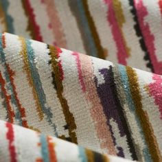 multicolored striped fabric with vertical stripes on the outside and inside, close up