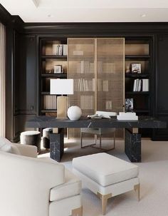 a living room with black walls and white furniture