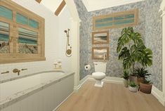 a bathroom with blue and white wallpaper, wood flooring and a plant in the corner