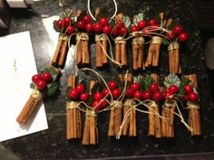 some cinnamon sticks with red berries tied to them