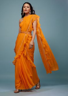 📌Hey! Please message us if you have any questions. We'll definitely assist you. 1. "This lovely mustard yellow saree will elevate your sense of style with its ready-pleated drape and exquisitely frilled pallu. This elegant saree is ideal for festive occasions because it is made of fine fabric. 2. With this mustard yellow pre-pleated saree's frill pallu, which adds a sense of drama to your appearance, you may command attention. It is a practical and stylish option for any fashion-conscious woman because the pleats are professionally made for a hassle-free wearing experience. 3. "Get ready to draw attention with this mustard yellow saree, which includes a pre-pleated pallu with stylish frills. This saree is a standout piece for any occasion and shows off your immaculate sense of style thank Mustard Yellow Saree, Pleated Saree, Cotton Saree Designs, Yellow Saree, Party Kleidung, Saree Trends, Elegant Saree, Style Expert, Fine Fabric