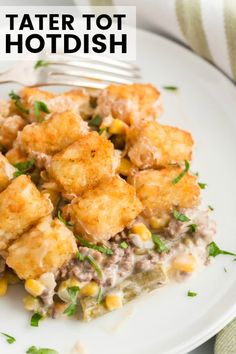 tater tot hotdish on a white plate with a fork