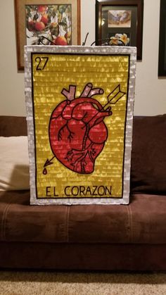 an art project made out of stained glass with the image of a heart on it