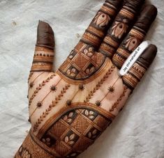 a hendi with intricate designs on it's palm