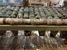 there are many bracelets on display in the store window and one is for sale