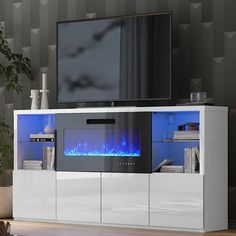 an entertainment center with a television and fireplace