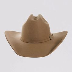 Introducing the Cattleman Womens Felt Cowboy Hat, a true iconic Cattleman-shaped crown with a shovel brim for that Yellowstone Dutton Ranch Hat look. Offered by American Hat Makers means that you can rest easy because it is backed by our 50 years of experience and Lifetime Guarantee. Featuring a sewn-in sweatband with a unique hidden pull strap tightening system for a one of a kind fit! Plus we’ll include two adhesive size reducers for an even more custom experience. Brim 4" Crown 4 3/4" Midweight Felt Wool | Matching Felt Band with Buckle Easily adjusts to your head size with hidden sewn-in pull straps Package includes two (free) adhesive size reducers to make a perfect fit Color: Sand Ranch Hat, Yellowstone Dutton Ranch, Felt Cowboy Hat, American Hat Makers, American Hat, Dutton Ranch, Felt Cowboy Hats, Cowgirl Hat, Felt Wool