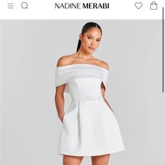 a white dress with an off the shoulder neckline and short sleeves is on sale