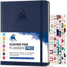 a blue planner book with stickers on the cover and an image of a dolphin