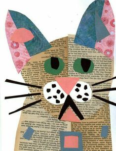 a cat made out of an old book with paper on it's face and ears