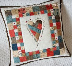 a decorative pillow with a heart on it