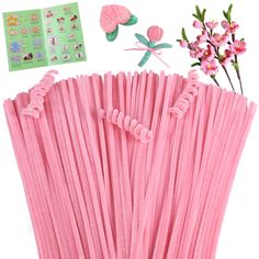 pink paper straws with flowers and stickers on the top, including one flower