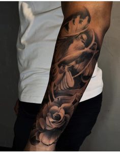 a man with a black and white tattoo on his arm