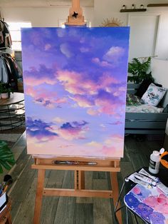 an easel with a painting on it in a room